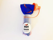 Load image into Gallery viewer, Unique food socks. These socks are full of chili peppers and come in their own hot sauce container. Food socks that make a creative gift from www.pomelosocks.com
