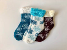 Load image into Gallery viewer, Keep warm and toasty this winter in these soft and cozy socks.  This snowflake set from Pomelo Socks makes for a great gift.
