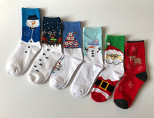 Load image into Gallery viewer, Fun and festive winter holiday socks featuring snowmen reindeer and Santa. Great holiday gifts for Christmas. Creative gift socks from Pomelo Socks.
