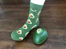 Load image into Gallery viewer, Unique food socks.  These socks are full of avocados and come in their own avocado shaped container.  Food socks that make a creative gift from www.pomelosocks.com
